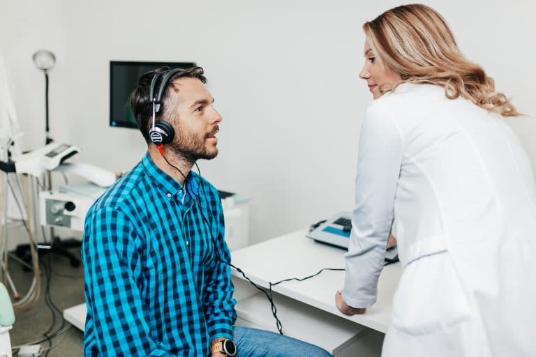 Man gets a hearing evaluation.