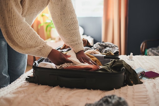 Packing a suitcase, preparing for vacation